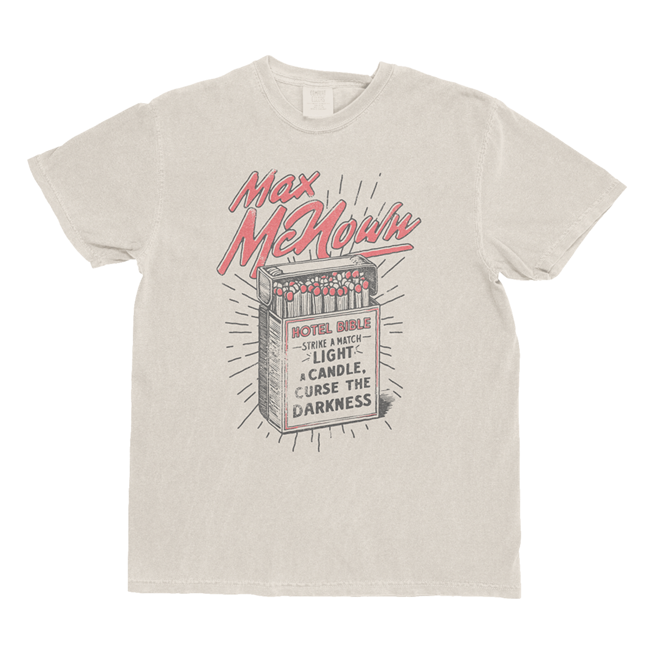 Ivory tee featuring matchbox design with text that reads "Hotel Bible - Strike A Match Light A Candle, Curse The Darkness"