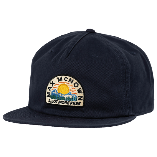 Navy hat with mountain, trees, and sun design