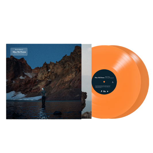 A vinyl record with an orange tint and a matching album cover featuring a landscape with mountains and water.